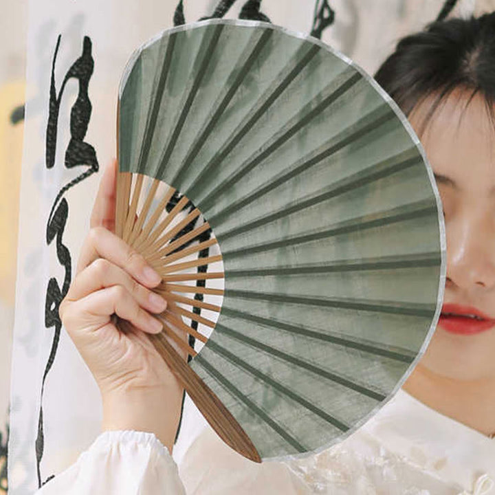 Éventail pliable en bambou à main en forme de coquillage de couleur unie rétro avec Buddha Stones
