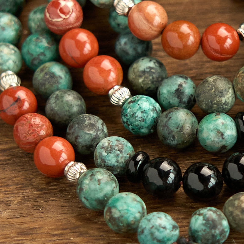 Bracelet de protection à pompon en Buddha Stones 108 Mala en onyx noir naturel et jaspe rouge avec perles turquoise