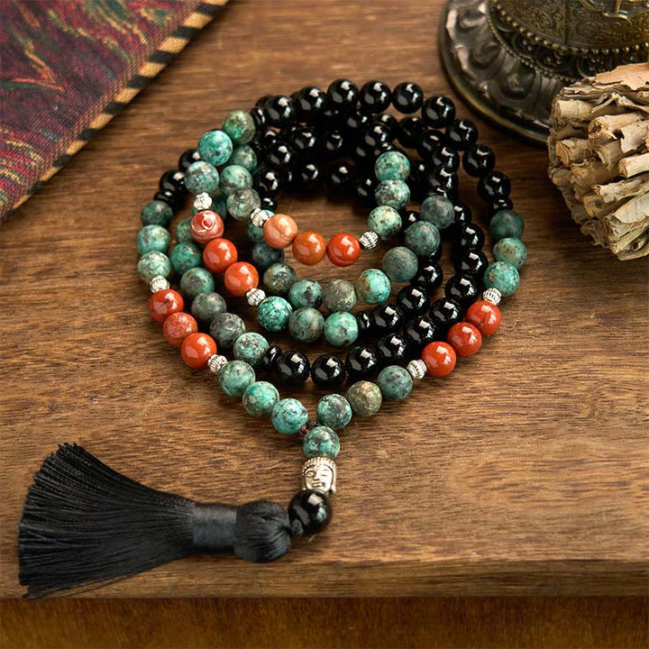 Bracelet de protection à pompon en Buddha Stones 108 Mala en onyx noir naturel et jaspe rouge avec perles turquoise