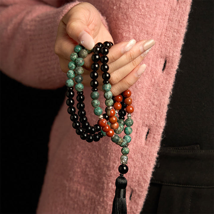Bracelet de protection à pompon en Buddha Stones 108 Mala en onyx noir naturel et jaspe rouge avec perles turquoise