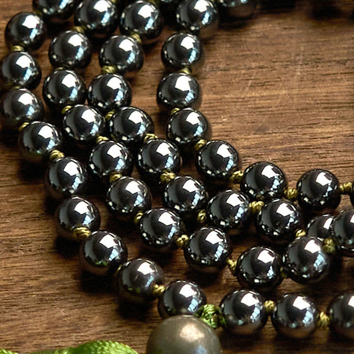 Bracelet puissant en Buddha Stones de Mala en pierre naturelle et pompon