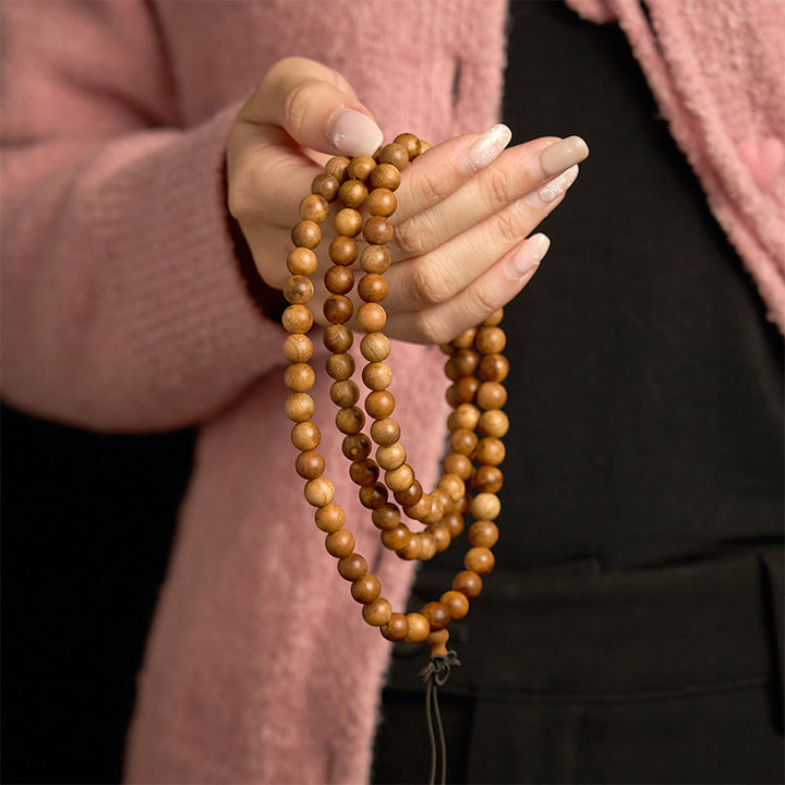 Bracelet de protection poli à la main en bois de pêche avec 108 perles de Mala en Buddha Stones
