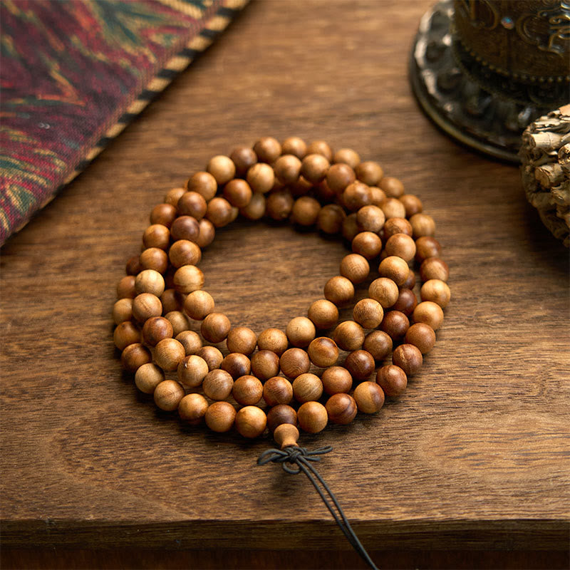 Bracelet de protection poli à la main en bois de pêche avec 108 perles de Mala en Buddha Stones