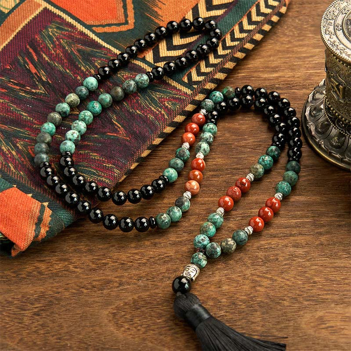 Bracelet de protection à pompon en Buddha Stones 108 Mala en onyx noir naturel et jaspe rouge avec perles turquoise