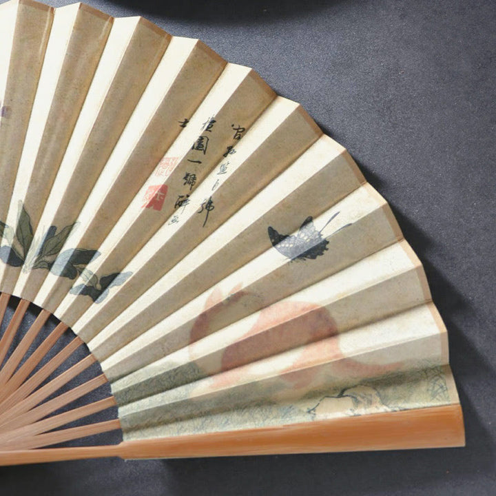 Éventail pliant en bambou et coton avec motif de Buddha Stones , papillon, chat, fleur