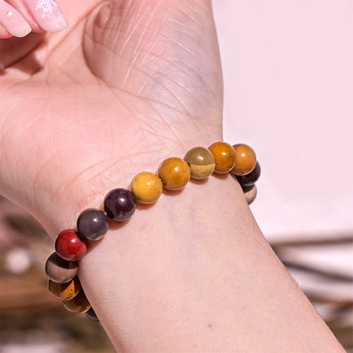 Bracelet de courage positif de la série de couleurs chaudes Buddha Stones stimulent la vitalité