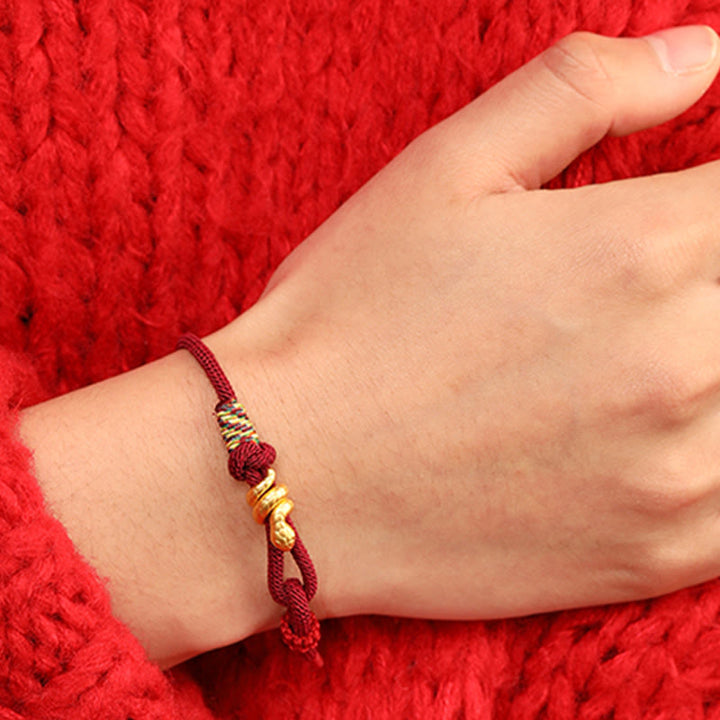 Bracelet tressé en corde de protection porte-bonheur fait main en or 999 avec motif de l'année du serpent