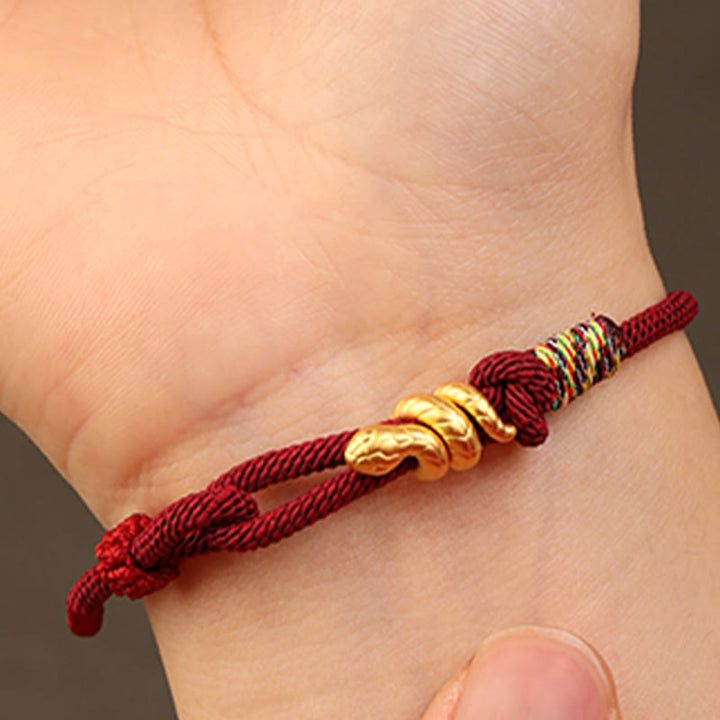Bracelet tressé en corde de protection porte-bonheur fait main en or 999 avec motif de l'année du serpent