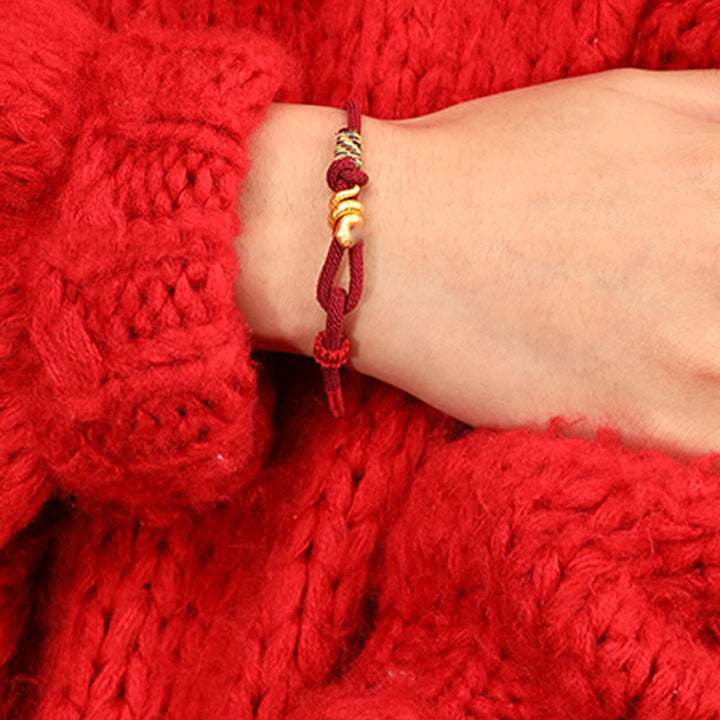 Bracelet tressé en corde de protection porte-bonheur fait main en or 999 avec motif de l'année du serpent