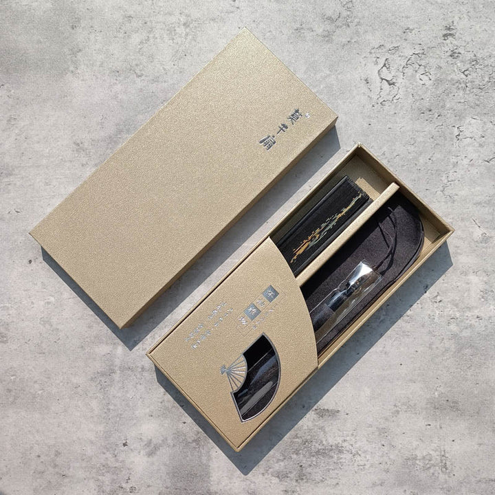 Éventail pliable en bambou à imprimé feuilles de bambou noir avec Buddha Stones