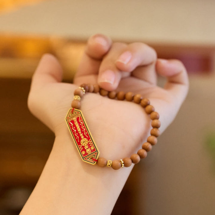 Bracelet d'harmonie en cuivre plaqué or avec perles en bois de santal et Buddha Stones, caractère chinois Bagua Yin Yang