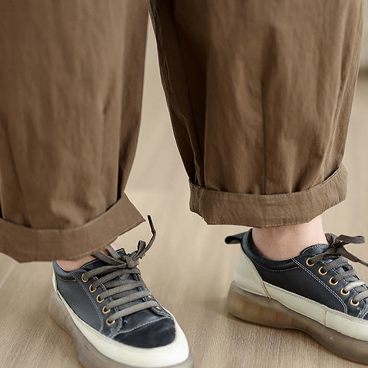 Pantalon décontracté en coton et lin pour femme avec poches et un bouton sur le dessus , couleur unie