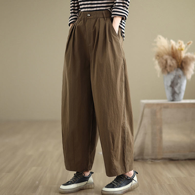 Pantalon décontracté en coton et lin pour femme avec poches et un bouton sur le dessus , couleur unie