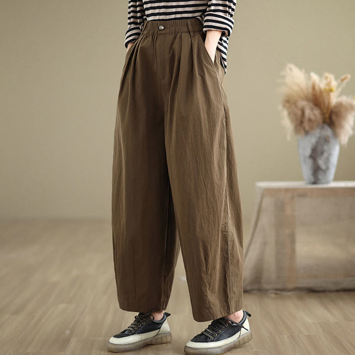 Pantalon décontracté en coton et lin pour femme avec poches et un bouton sur le dessus , couleur unie