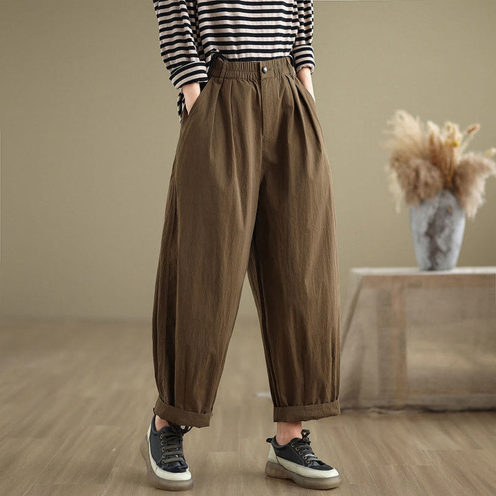 Pantalon décontracté en coton et lin pour femme avec poches et un bouton sur le dessus , couleur unie