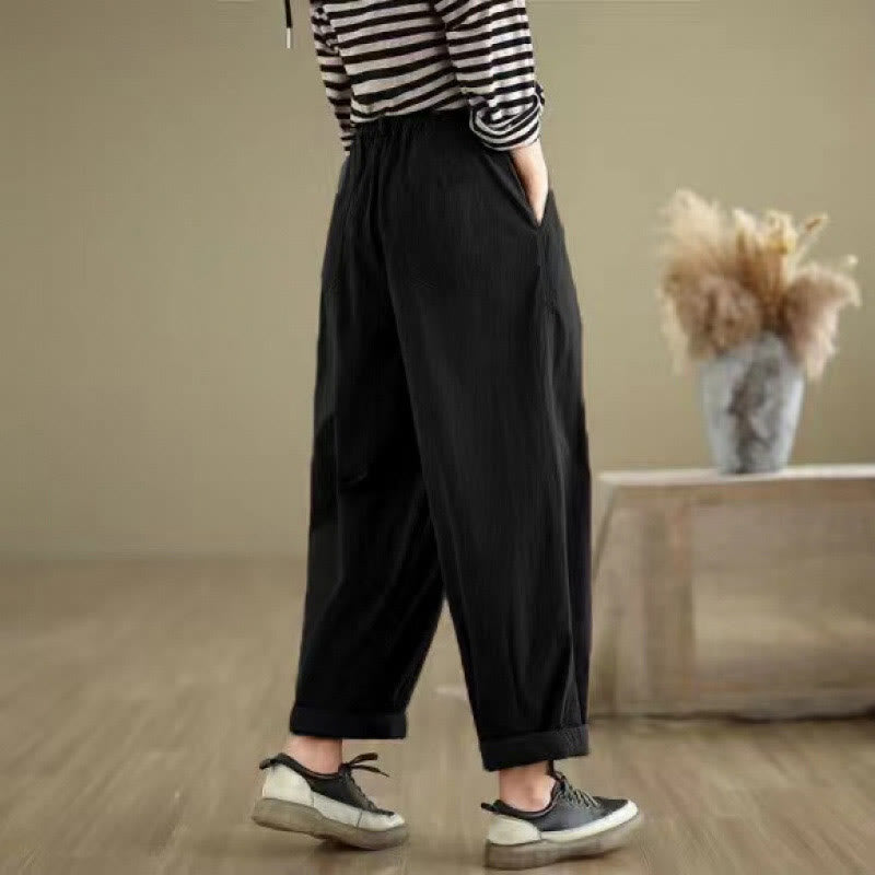Pantalon décontracté en coton et lin pour femme avec poches et un bouton sur le dessus , couleur unie