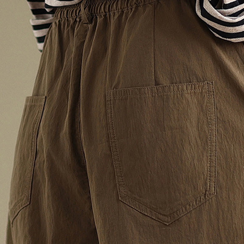 Pantalon décontracté en coton et lin pour femme avec poches et un bouton sur le dessus , couleur unie