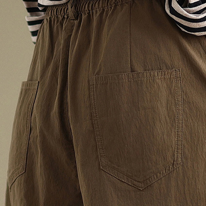 Pantalon décontracté en coton et lin pour femme avec poches et un bouton sur le dessus , couleur unie