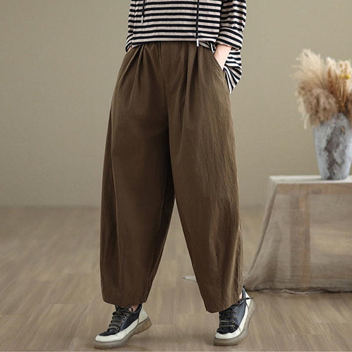 Pantalon décontracté en coton et lin pour femme avec poches et un bouton sur le dessus , couleur unie