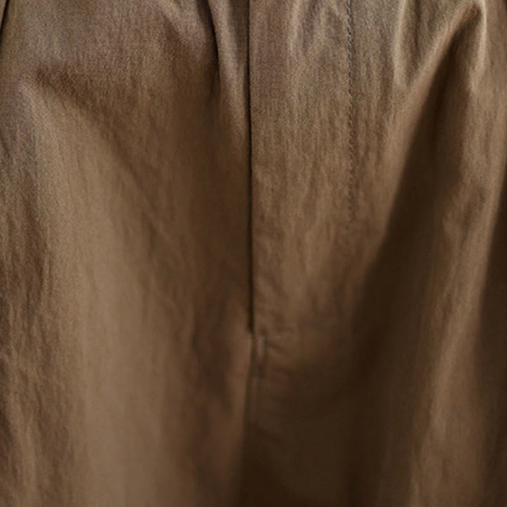 Pantalon décontracté en coton et lin pour femme avec poches et un bouton sur le dessus , couleur unie
