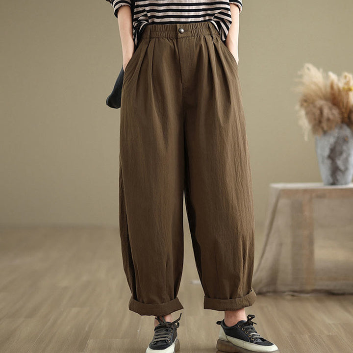 Pantalon décontracté en coton et lin pour femme avec poches et un bouton sur le dessus , couleur unie