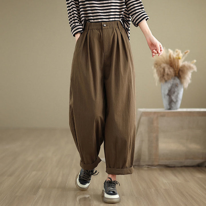Pantalon décontracté en coton et lin pour femme avec poches et un bouton sur le dessus , couleur unie