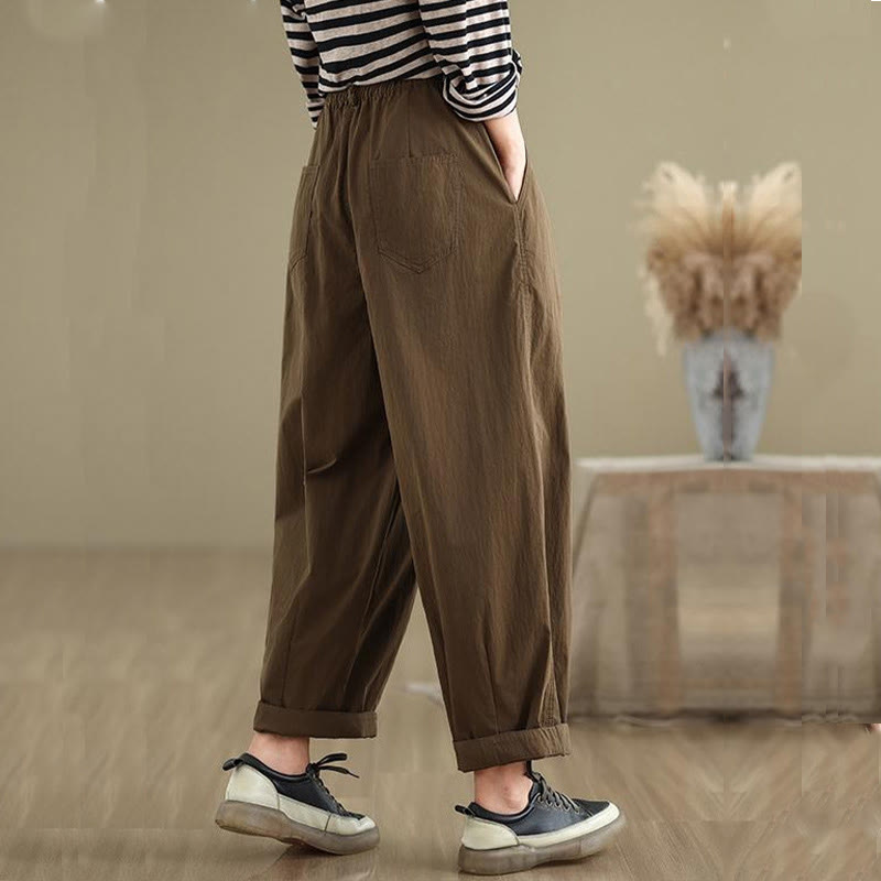 Pantalon décontracté en coton et lin pour femme avec poches et un bouton sur le dessus , couleur unie