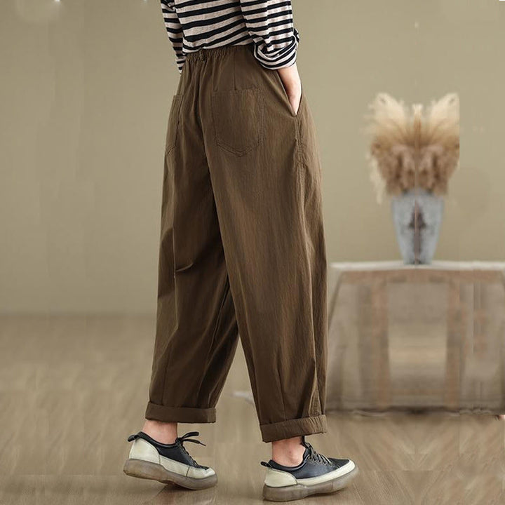 Pantalon décontracté en coton et lin pour femme avec poches et un bouton sur le dessus , couleur unie