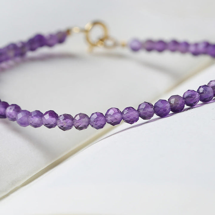 Bracelet de conscience spirituelle en cuivre plaqué or 14 carats avec perles ultra-fines en améthyste naturelle de 3 mm et Buddha Stones
