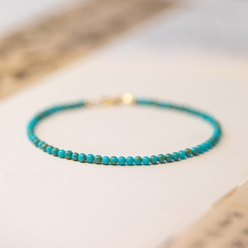Bracelet de sagesse en cuivre plaqué or 14 carats avec perles ultra-fines turquoise de 2 mm et Buddha Stones