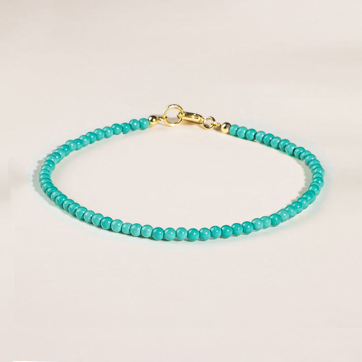 Bracelet de sagesse en cuivre plaqué or 14 carats avec perles ultra-fines turquoise de 2 mm et Buddha Stones