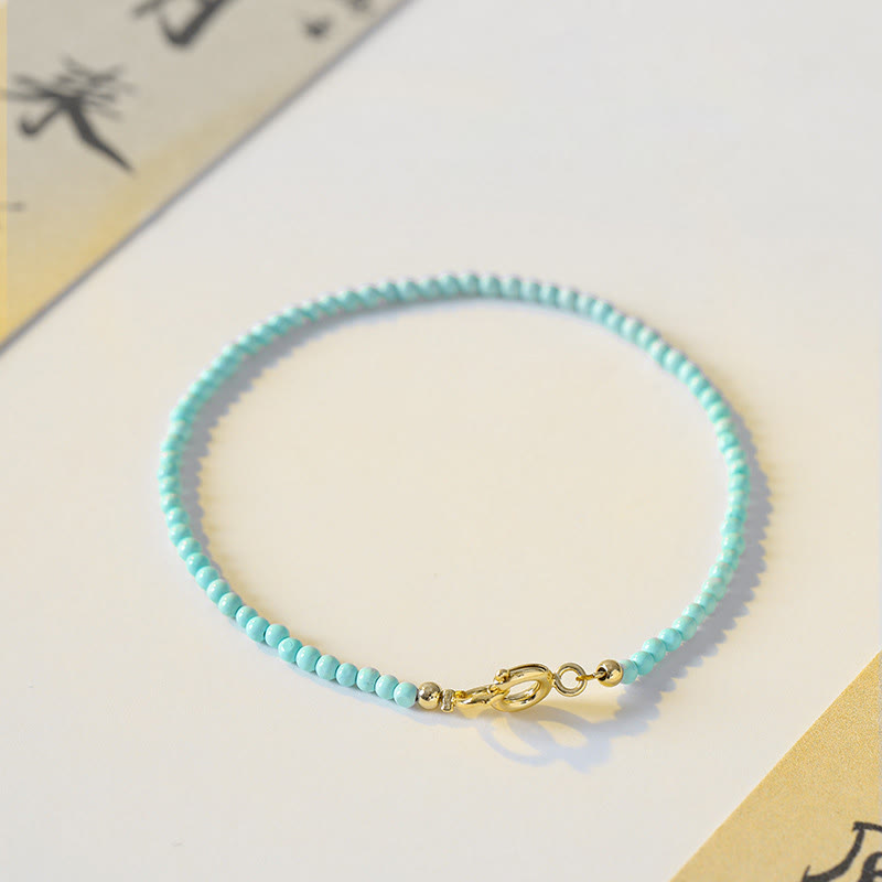 Bracelet de sagesse en cuivre plaqué or 14 carats avec perles ultra-fines turquoise de 2 mm et Buddha Stones