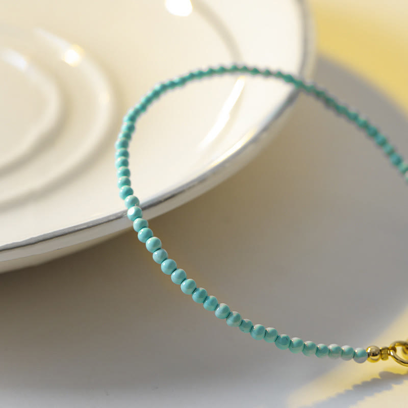 Bracelet de sagesse en cuivre plaqué or 14 carats avec perles ultra-fines turquoise de 2 mm et Buddha Stones