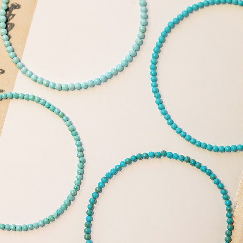 Bracelet de sagesse en cuivre plaqué or 14 carats avec perles ultra-fines turquoise de 2 mm et Buddha Stones