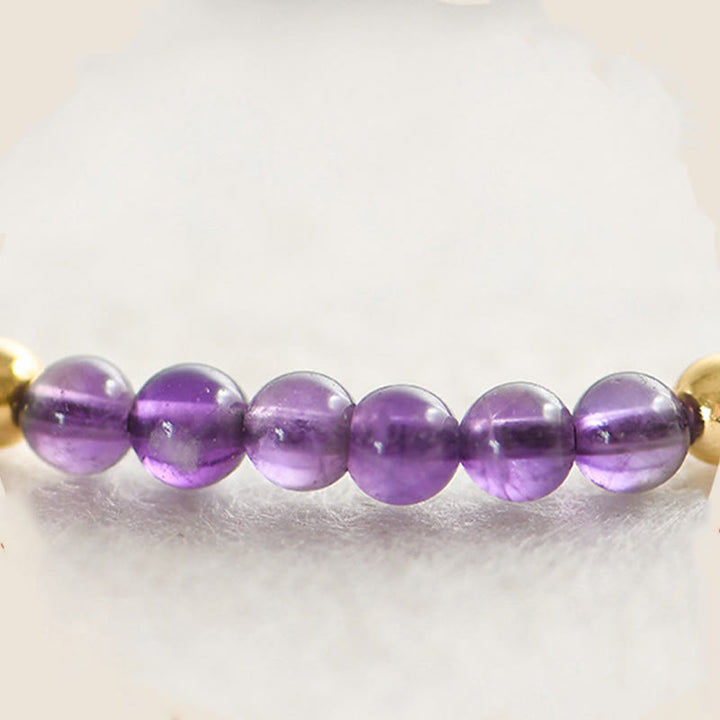 Bracelet en Buddha Stones 4 mm fait à la main en améthyste naturelle 14 carats avec perles en cuivre plaqué or tressé pour soulager le stress