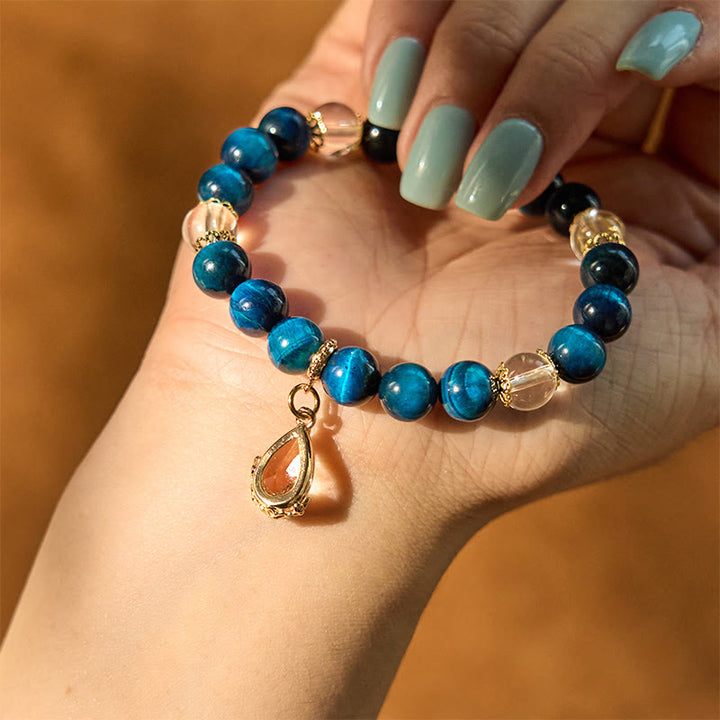 Bracelet de force en forme de goutte d'eau en cristal blanc et œil de tigre bleu Buddha Stones