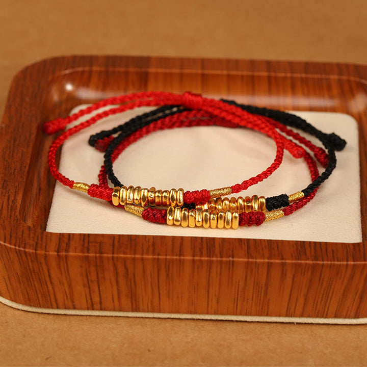 Bracelet tressé ultra fin en petites pièces de Buddha Stones en or 999 avec protection et chance