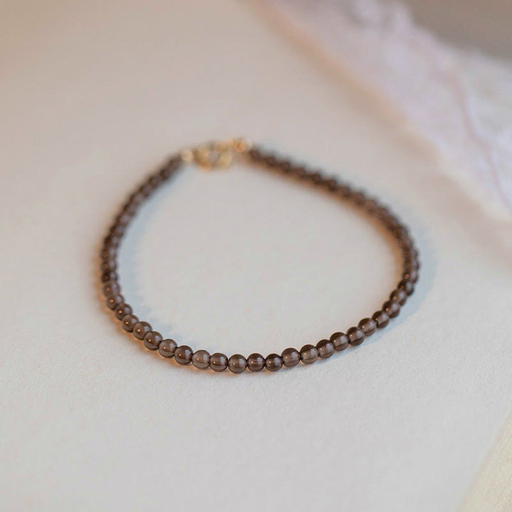 Bracelet de réussite en perles ultra-fines en quartz fumé et obsidienne noire Buddha Stones