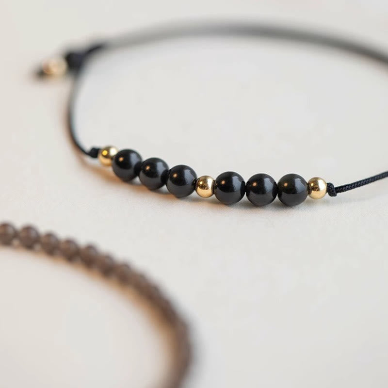 Bracelet de réussite en perles ultra-fines en quartz fumé et obsidienne noire Buddha Stones