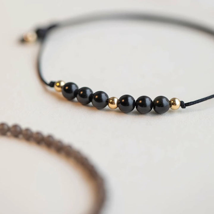 Bracelet de réussite en perles ultra-fines en quartz fumé et obsidienne noire Buddha Stones