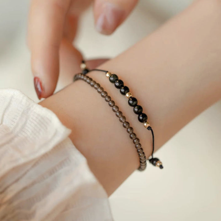 Bracelet de réussite en perles ultra-fines en quartz fumé et obsidienne noire Buddha Stones