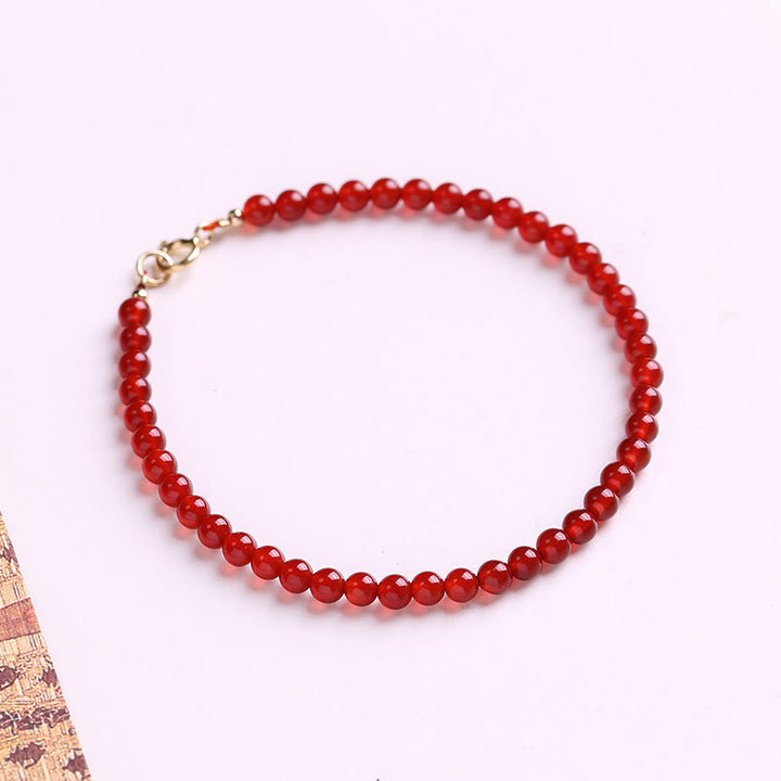 Bracelet calme en petites perles d'agate rouge ultra-fines de Buddha Stones