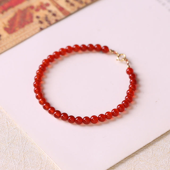 Bracelet calme en petites perles d'agate rouge ultra-fines de Buddha Stones