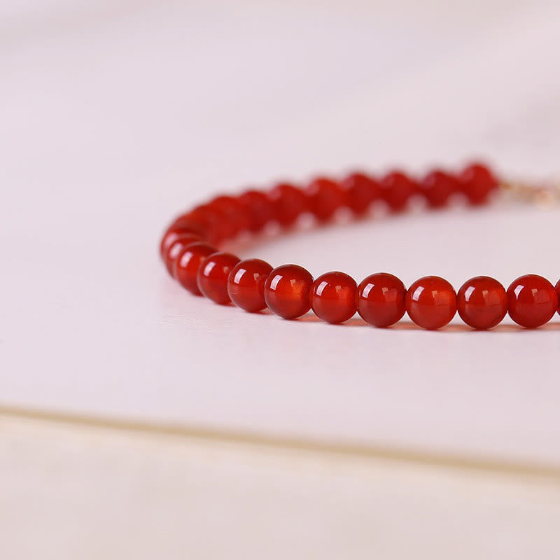 Bracelet calme en petites perles d'agate rouge ultra-fines de Buddha Stones