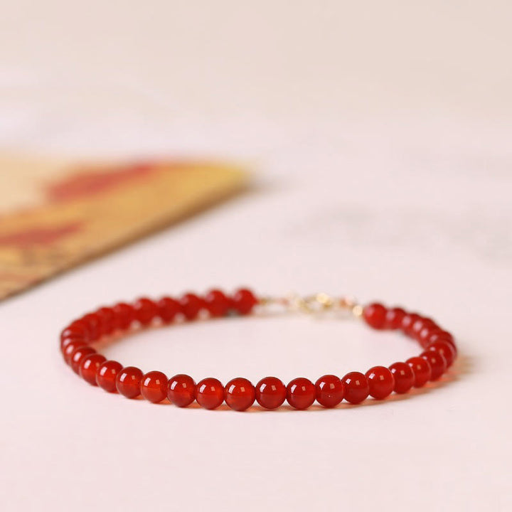 Bracelet calme en petites perles d'agate rouge ultra-fines de Buddha Stones