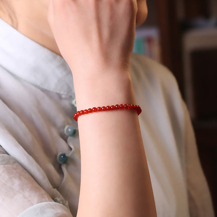 Bracelet calme en petites perles d'agate rouge ultra-fines de Buddha Stones
