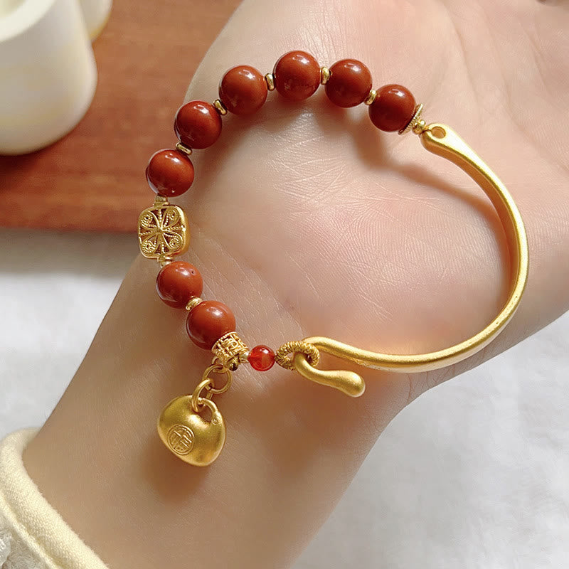 Bracelet demi-lingot en agate rouge du sud avec personnage Fu de Buddha Stones
