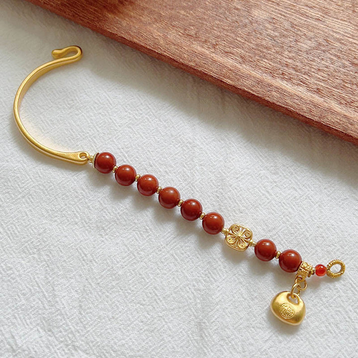 Bracelet demi-lingot en agate rouge du sud avec personnage Fu de Buddha Stones