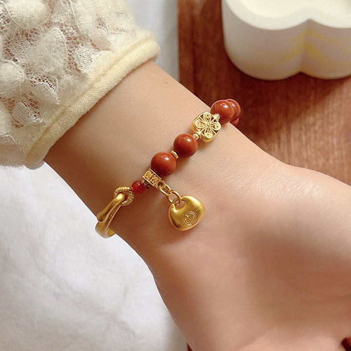 Bracelet demi-lingot en agate rouge du sud avec personnage Fu de Buddha Stones