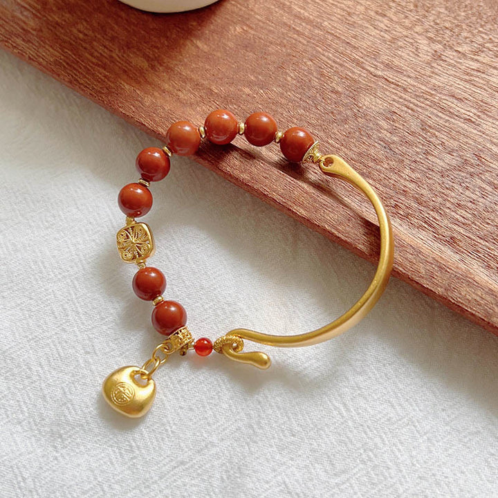 Bracelet demi-lingot en agate rouge du sud avec personnage Fu de Buddha Stones